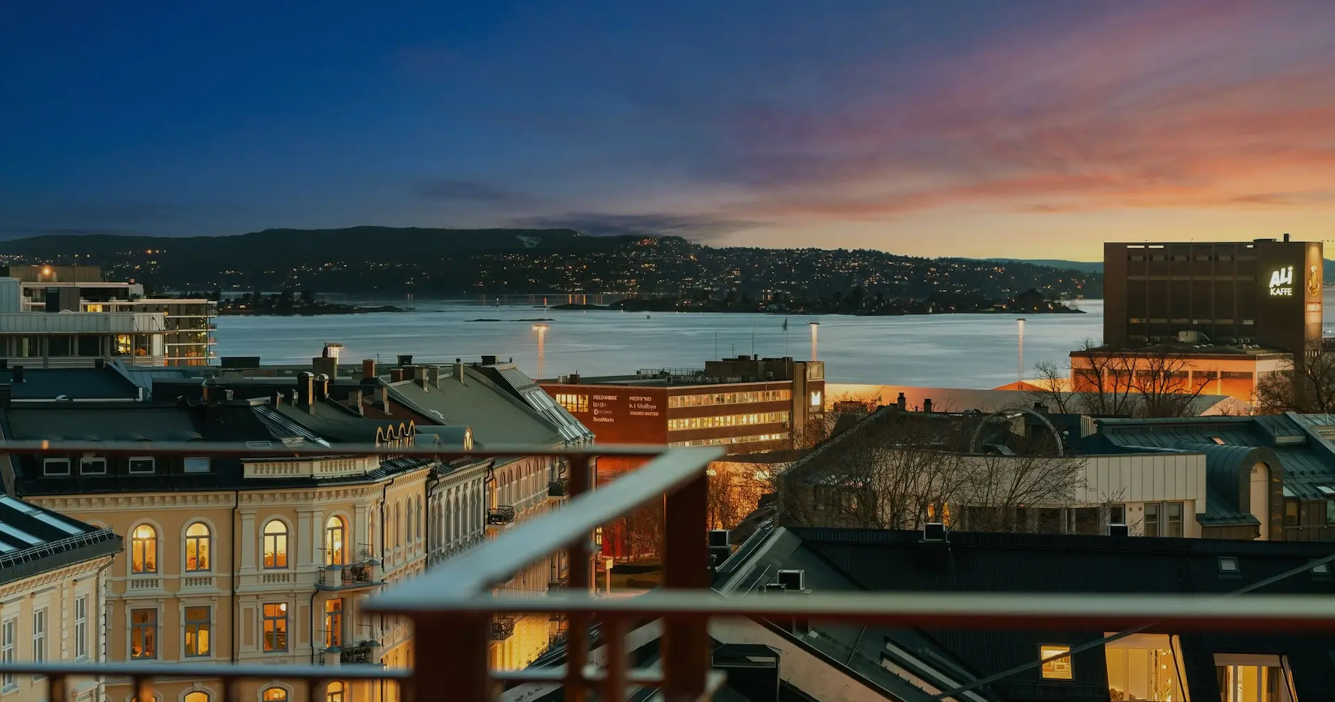 View on oslo rooftops, bay and fjord during sunset